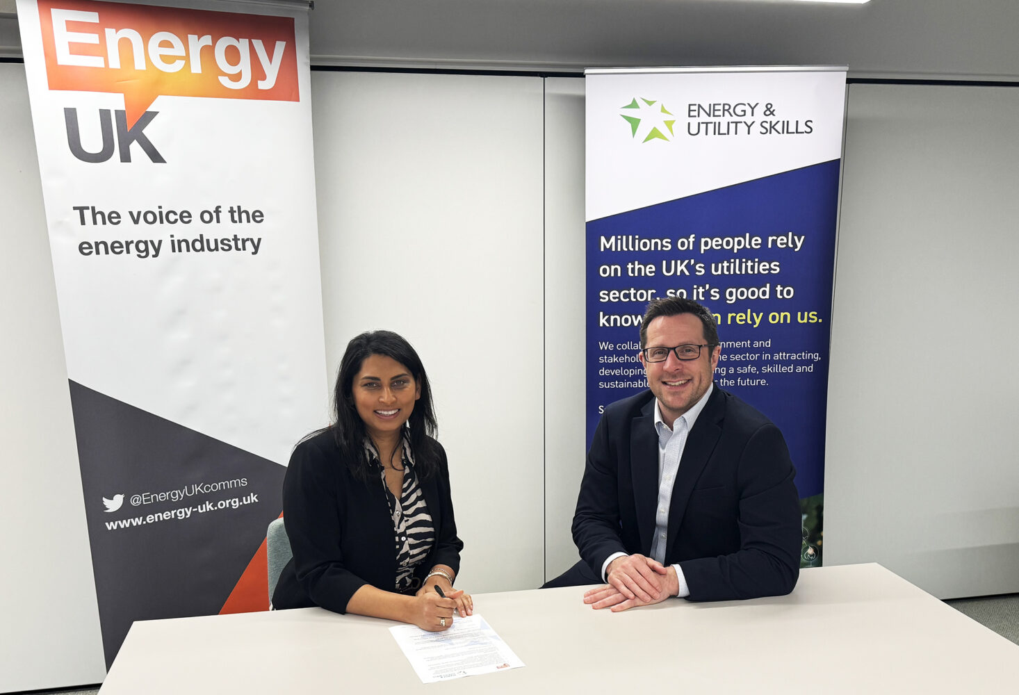 Dhara Vyas Chief Executive of Energy UK left and Paul Cox Group Chief Executive Energy Utility Skills right sign the new agreement 3